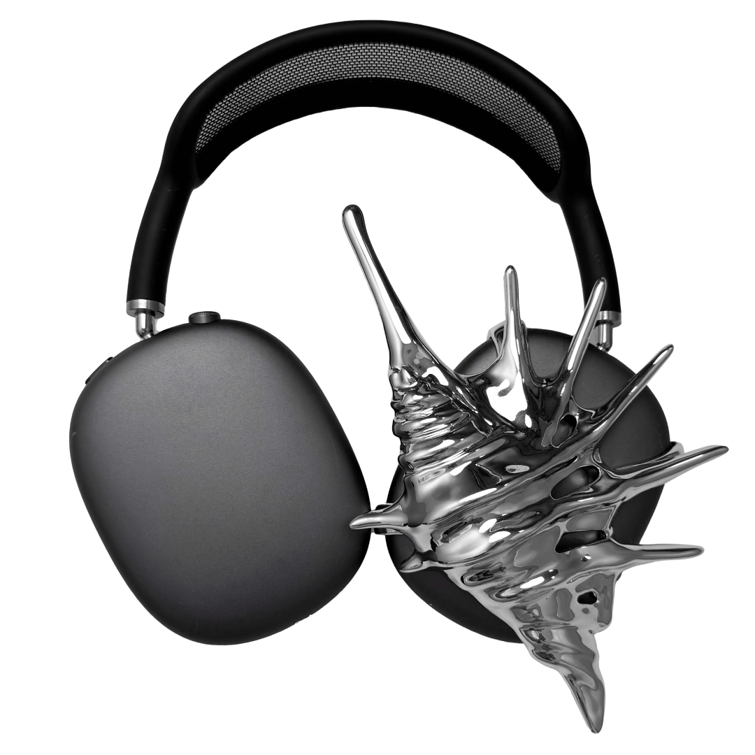 Over-ear Apple headphones adorned with spiky sculptural shells inspired by deep-sea murex forms, merging oceanic textures with bold acoustic design.