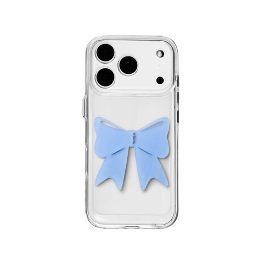 A modern iPhone case featuring a 3D acrylic ribbon ornament with long, flowing tails. Available in Sakura Pink and Azure Blue finishes. The case is shown on both a Reflective Silver metallic base and a Clear Transparent base, showcasing a minimalist yet playful fashion aesthetic.