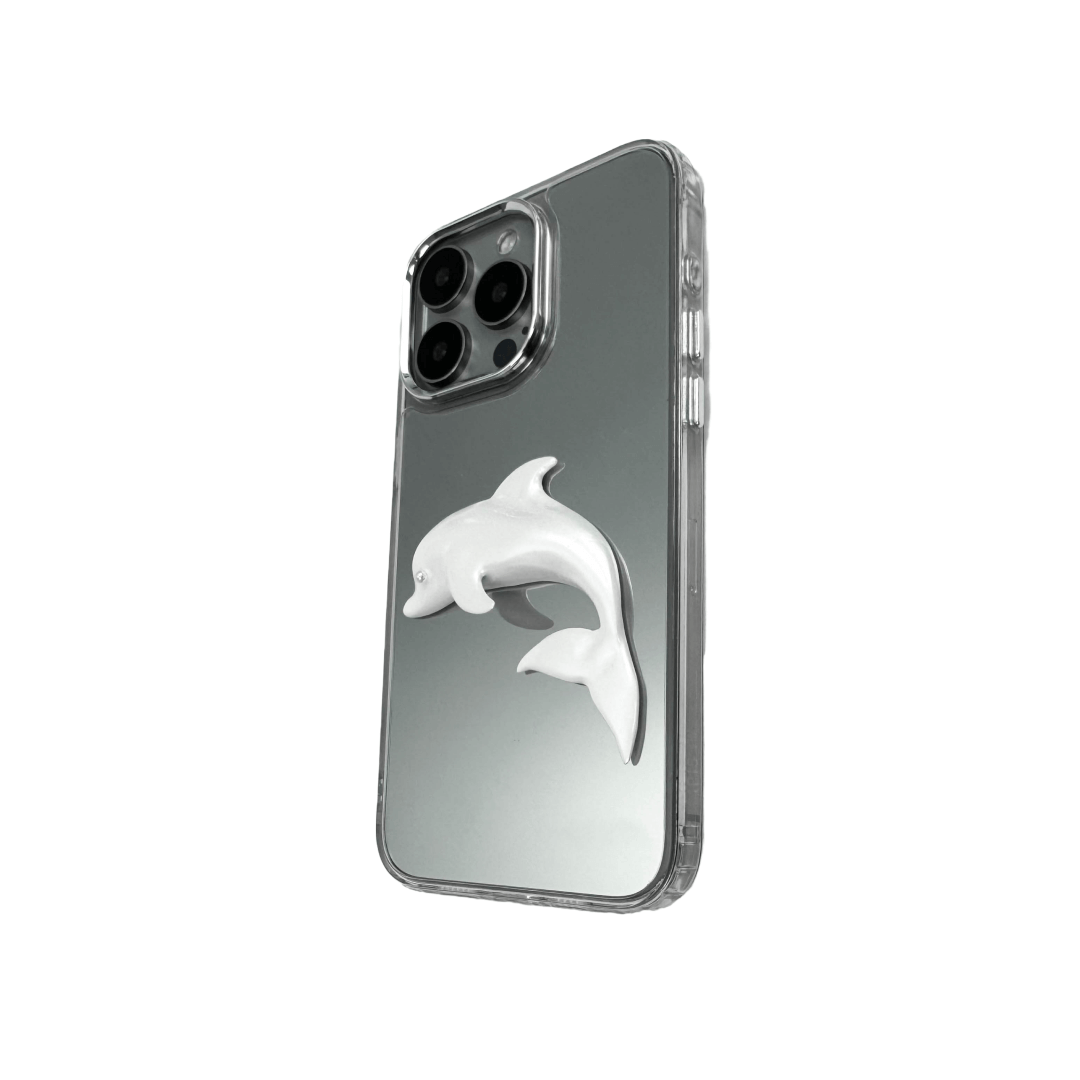 Matte phone case with a high-relief sculpted dolphin figure swimming diagonally across the back.