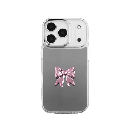 A collection of five clear or silver-based iPhone cases, each featuring a large, centered illustration of a stylized bow in a different color: silver, black, white, pink, and purple.