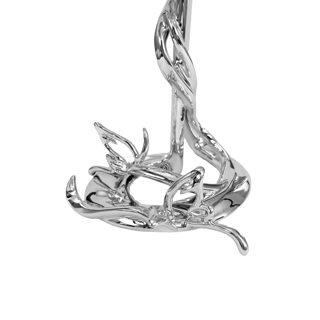 Chrome sculptural AirPods Max stand with twisted spiral base and butterfly details – luxury headphone holder