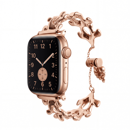 Luxury rose gold watch with intricate design on a white background