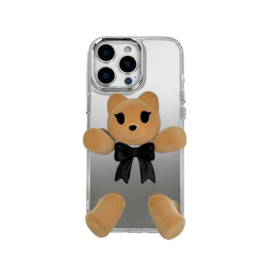 Transparent mirror phone case with a 3D teddy bear in brown flocking, wearing a black bow tie.