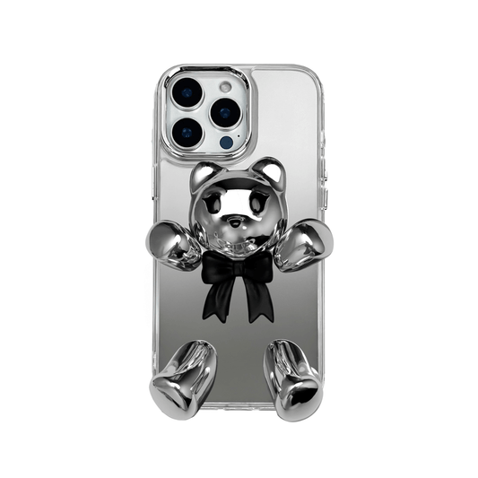 Transparent mirror phone case with a 3D teddy bear in brown flocking, wearing a black bow tie.