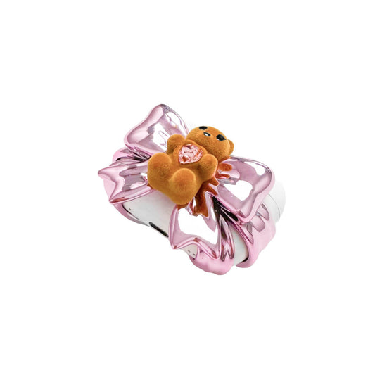 Bow Magic Bear AirPods Cover – Pink Edition featuring a beige gummy bear holding a pink crystal heart, centered on a metallic pink bow design.