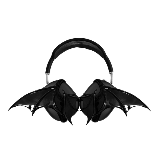 A high-fashion 3D attachment for AirPods Max headphones featuring sharp, sculpted demon wings. Available in two finishes: a high-shine Reflective Silver Chrome and a sleek Obsidian Black. The design is shown as both a single asymmetrical attachment and a symmetrical pair wrapping around the headphone ear cups.