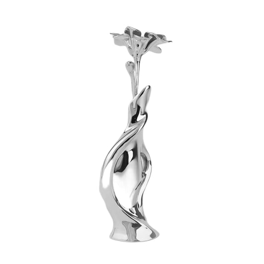 Futuristic silver vase with fluid sculptural form and blooming lily – sleek metallic design blending natural elegance and modern artistry