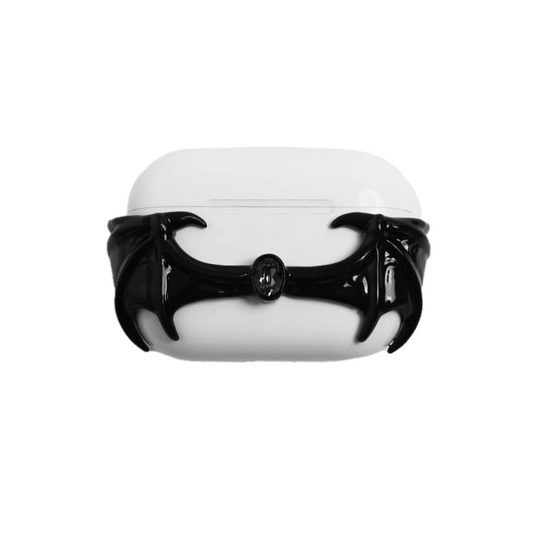 A protective cover for AirPods featuring 3D sculpted demon wings wrapping around the case with a central black Swarovski crystal. Shown in two versions: a reflective Silver Chrome wing and a Sleek Black wing, compatible with AirPods 4 and AirPods Pro models.