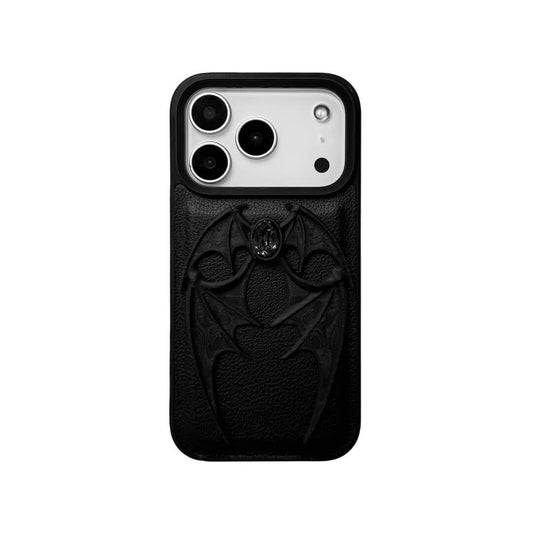 A high-fashion iPhone case featuring a pair of 3D-printed demon wings curving around a central sparkling gem, all in a natural matte black finish. Available in two variations: a minimalist Clear Transparent base and a luxurious Black Leather textured base, showcasing the intricate and edgy sculptural design.