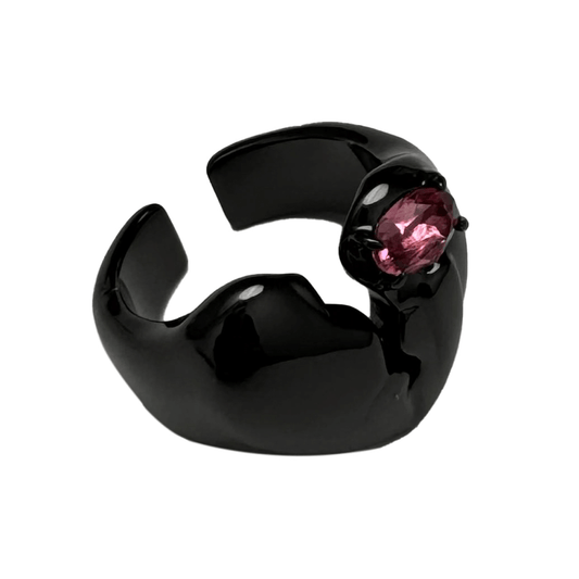 Wide band ring with a broken heart design and a pink Swarovski crystal centerpiece.