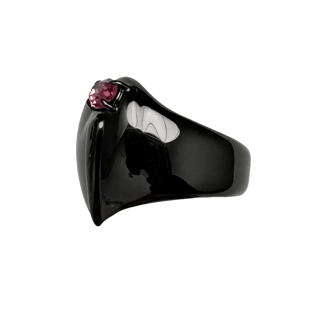 Wide band ring with a broken heart design and a pink Swarovski crystal centerpiece.