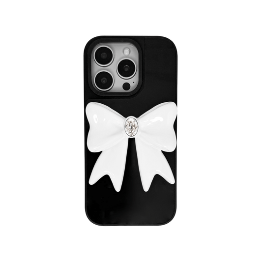Ivory Gem Bow iPhone Case with glossy white 3D bow and Swarovski crystal centerpiece, available in black, white, or pink gem colors.