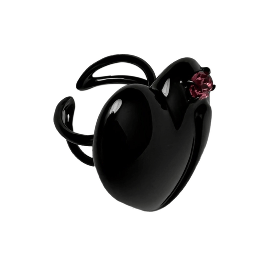 Slim band ring with a heart-shaped design and a pink Swarovski crystal centerpiece.