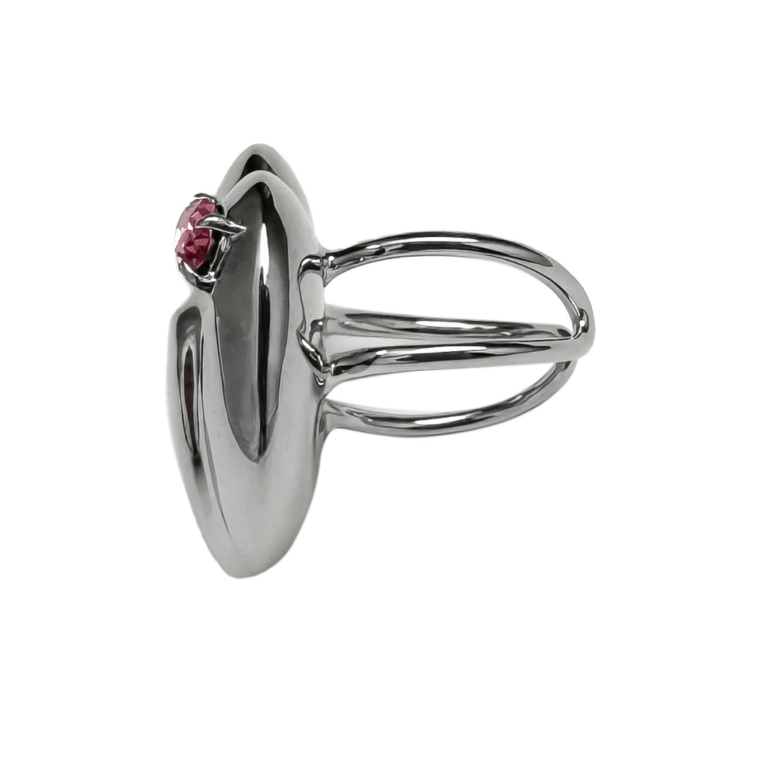 Slim band ring with a heart-shaped design and a pink Swarovski crystal centerpiece.