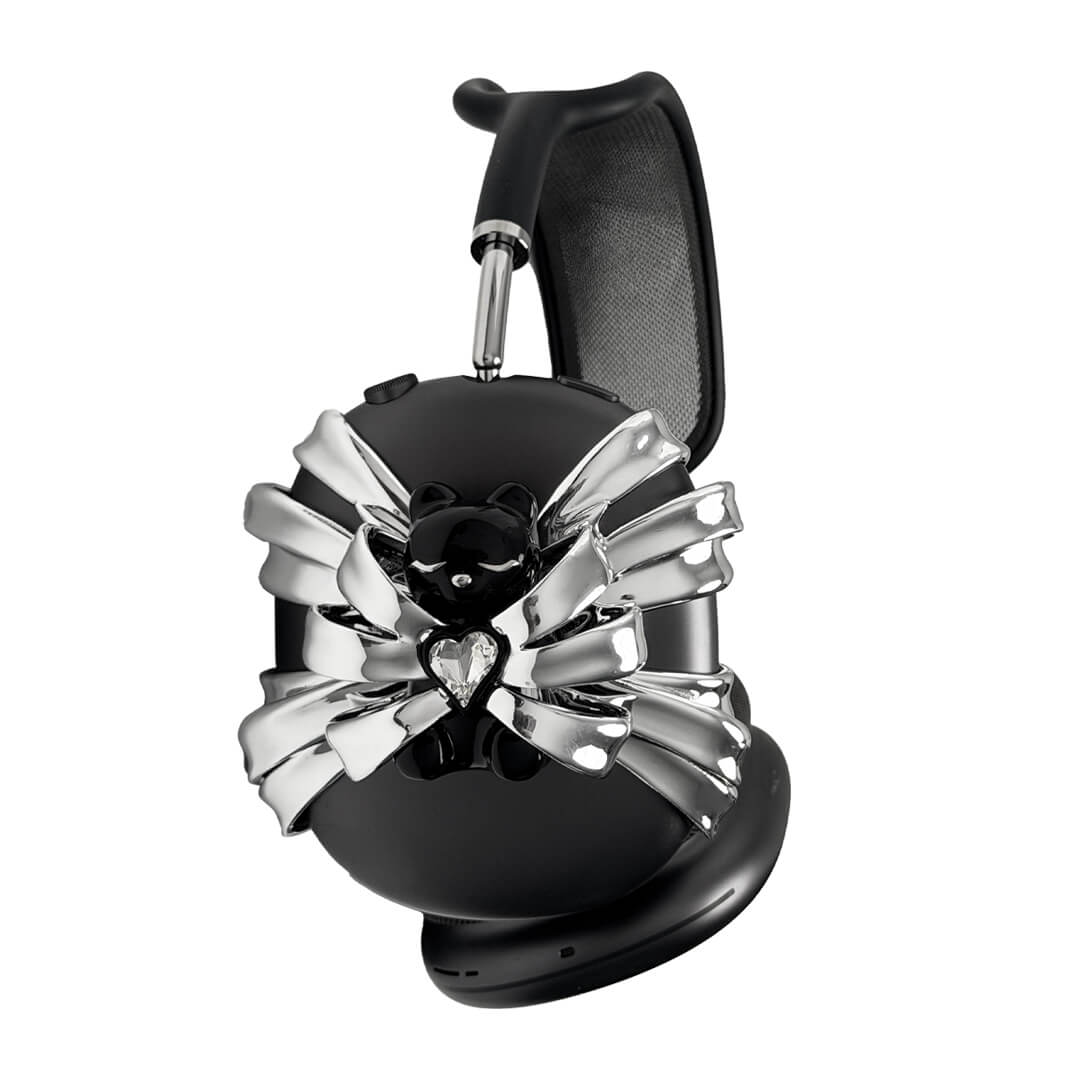 Ribbon Magic Bear AirPods Max cover featuring a glossy black bear holding a crystal heart, surrounded by layered metallic silver ribbons.