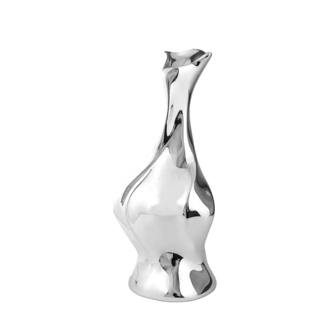 Futuristic chrome vase with fluid sculptural silhouette and blooming flower stem – high-shine metallic art object with organic elegance
