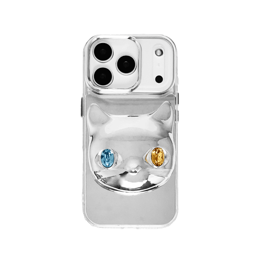 Silver mirror iPhone case with 3D cat face design, featuring mismatched gem eyes in blue and yellow — perfect for a quirky, futuristic feline aesthetic.