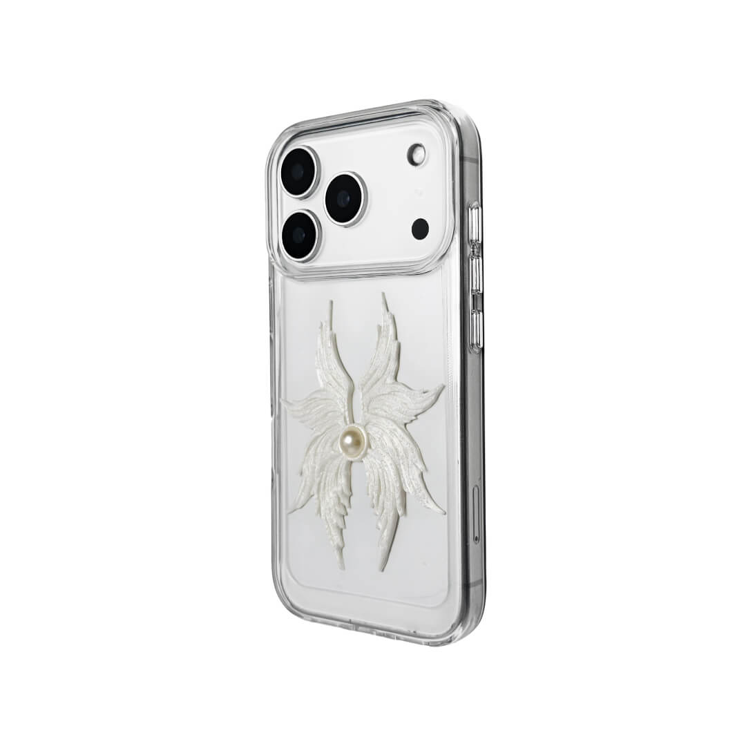 The Embroidered Angel Wings iPhone Case featuring intricate white feather/wing embroidery and a central pearl, shown on both the Crystal Clear (Transparent) and White Leather Texture base options.