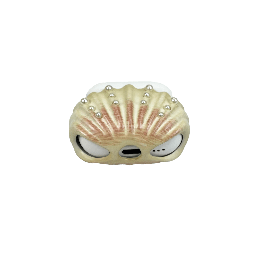 Shell-shaped headphone accessory with flowing ridges and embedded pearl-like orbs, designed to wrap around the device in a soft, ocean-inspired form.