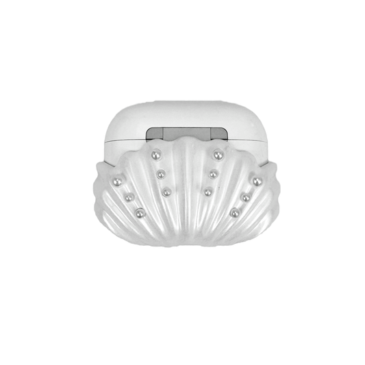 Shell-shaped headphone accessory with flowing ridges and embedded pearl-like orbs, designed to wrap around the device in a soft, ocean-inspired form.