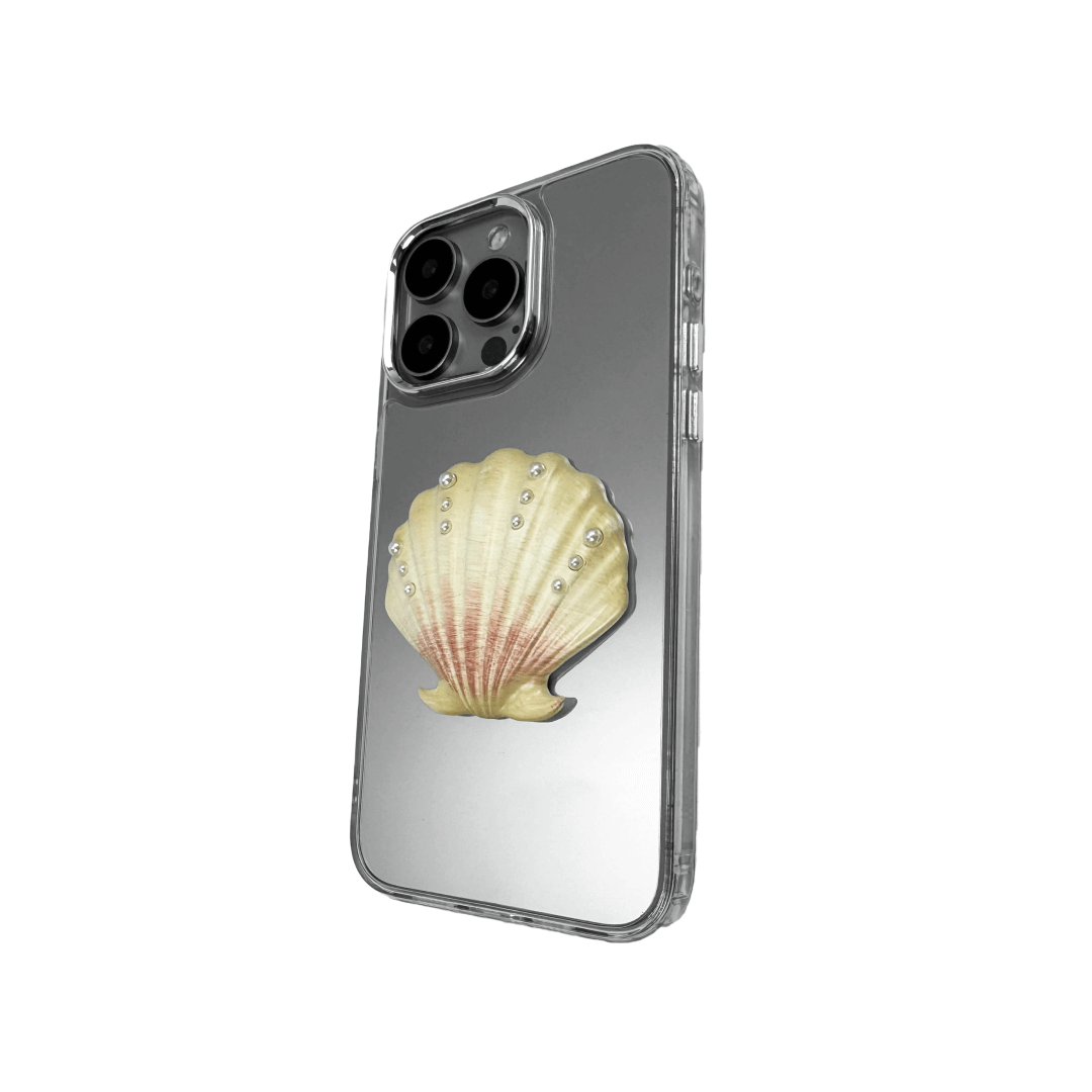 Matte phone case with a raised scallop shell design adorned with small pearl-like dots.