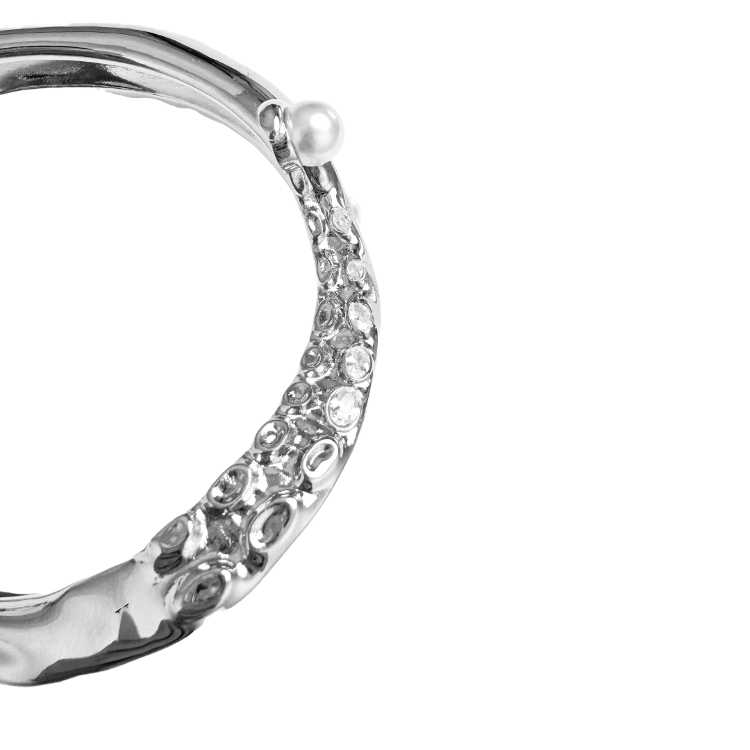 Black and silver octopus-inspired bracelet with pearl detail.