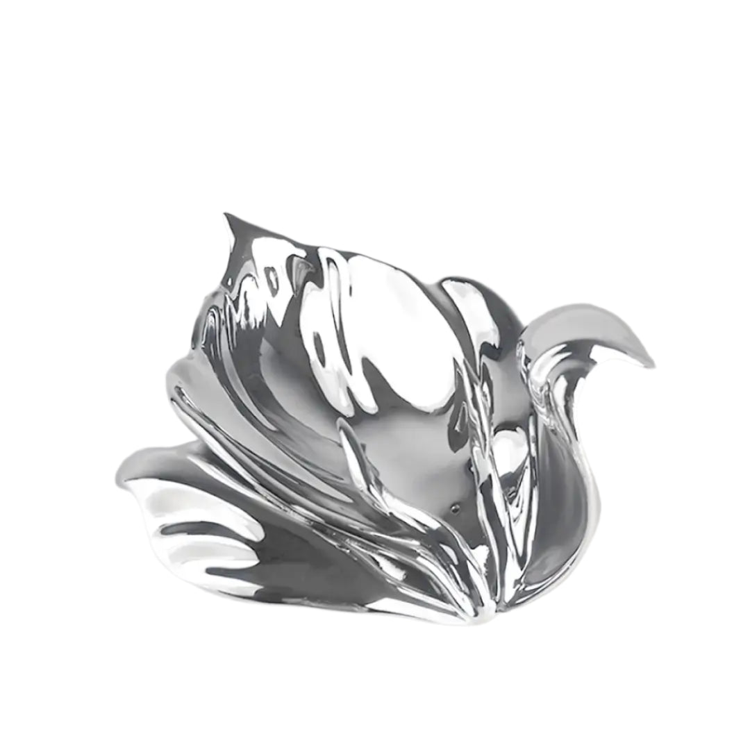Futuristic chrome incense holder with flowing petal silhouette – organic metallic design cradling incense stick in sculptural bloom