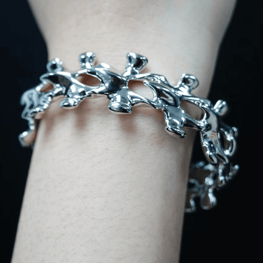Unleash luxury elegance with the Spine Bone Bracelet. Skeletal-inspired design and oxidized finish for gothic sophistication. Perfect for unisex layering.