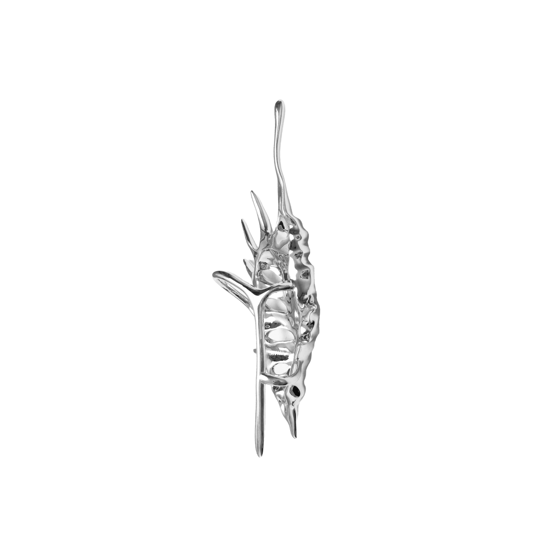 Seashell Ear Cuff — silver seashell-shaped ear cuff with smooth, flowing curves inspired by ocean waves.