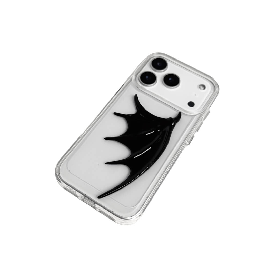 A 3D sculpted demon wing iPhone case with a raised black wing design, shown in both a transparent version and a black leather-textured version.