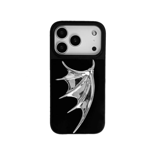 The Single Silver Demon Wing iPhone Case featuring a 3D sculpted silver metallic wing positioned on one side with a high-shine chrome finish. Shown in three base variations: Silver, Transparent, and Black.