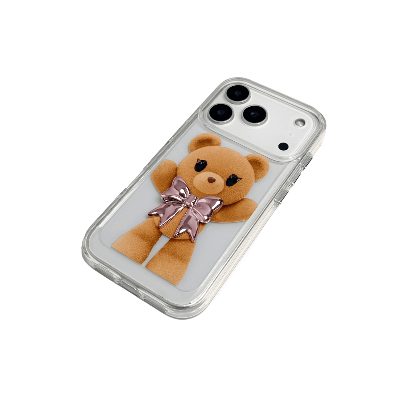 A clear iPhone case featuring an illustration of a standing brown teddy bear wearing a pink metallic bow tie. The case is transparent, allowing the phone's color to show through.