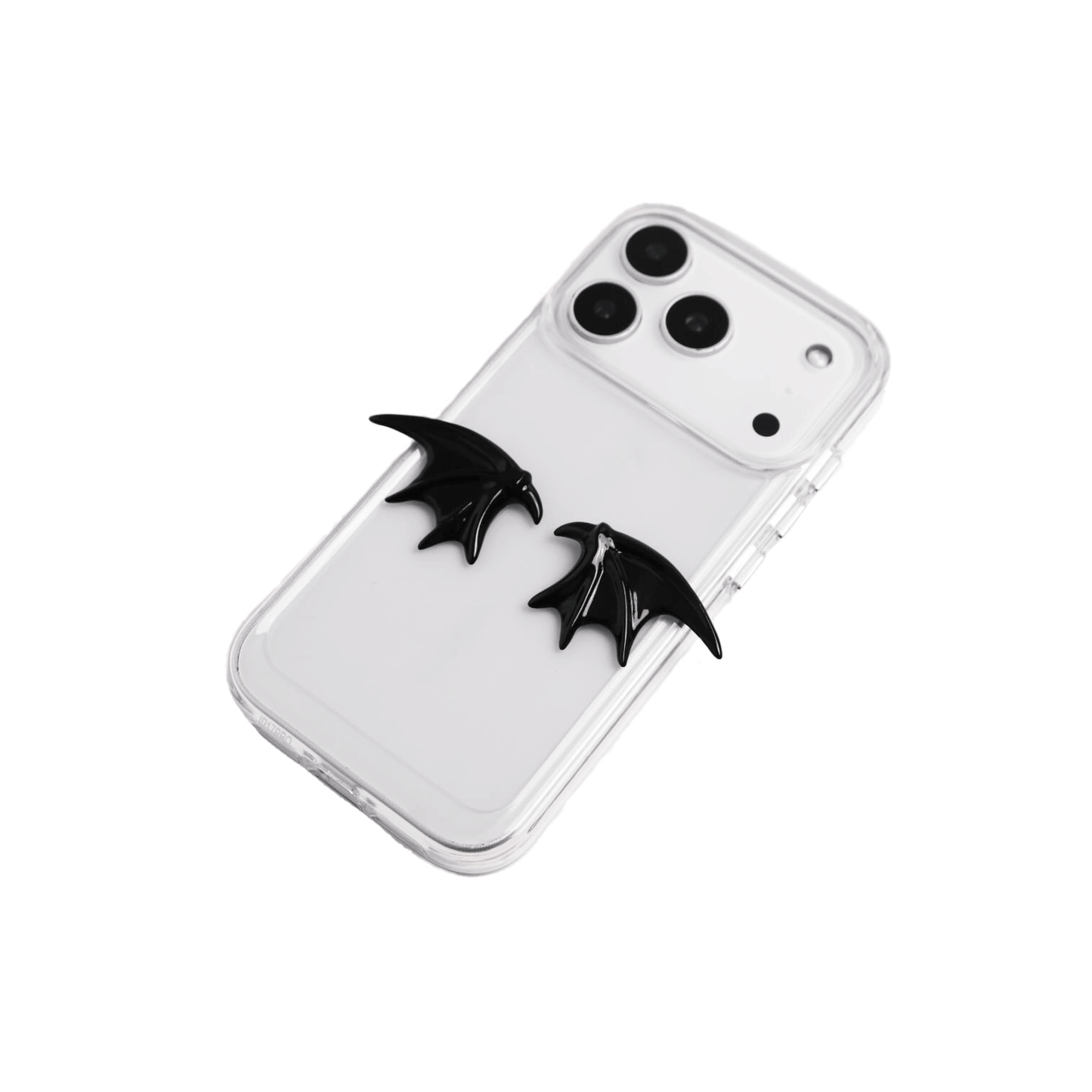 The Tiny Demon Wings iPhone Case featuring a pair of small, symmetrical 3D sculpted black bat-style wings on the lower portion of the case. Available in two base options: Crystal Clear (Transparent) and Black Lychee Leather.
