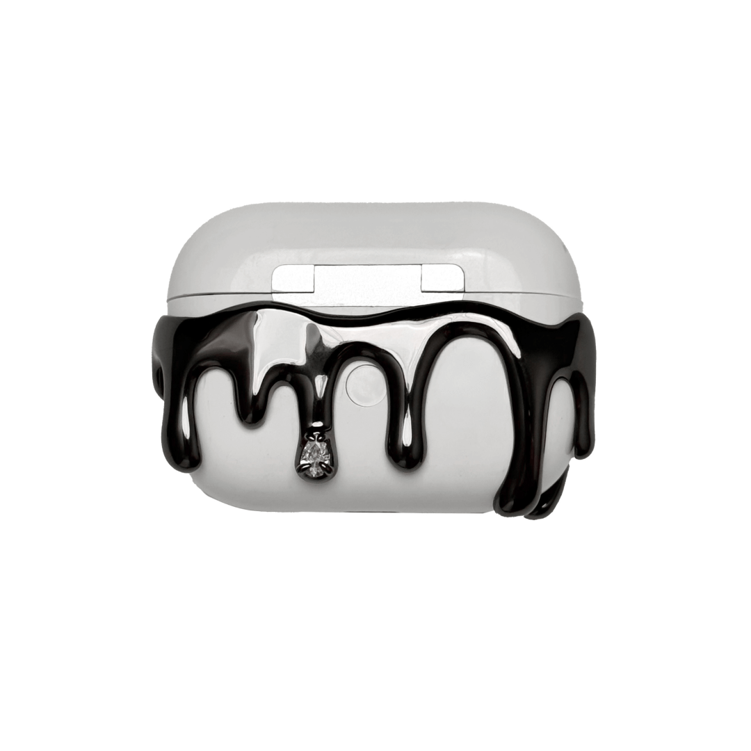 AirPods case with silver molten drip design and embedded crystals, resembling melted metal frozen mid-flow for a luxe, futuristic look.