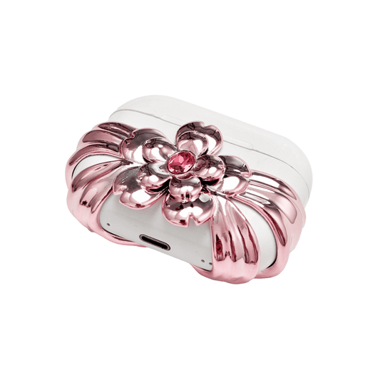 AirPods case cover with a multi-petal cherry blossom design in pink or silver, featuring a sparkling pink Swarovski crystal at the flower’s center for a refined, elegant touch.