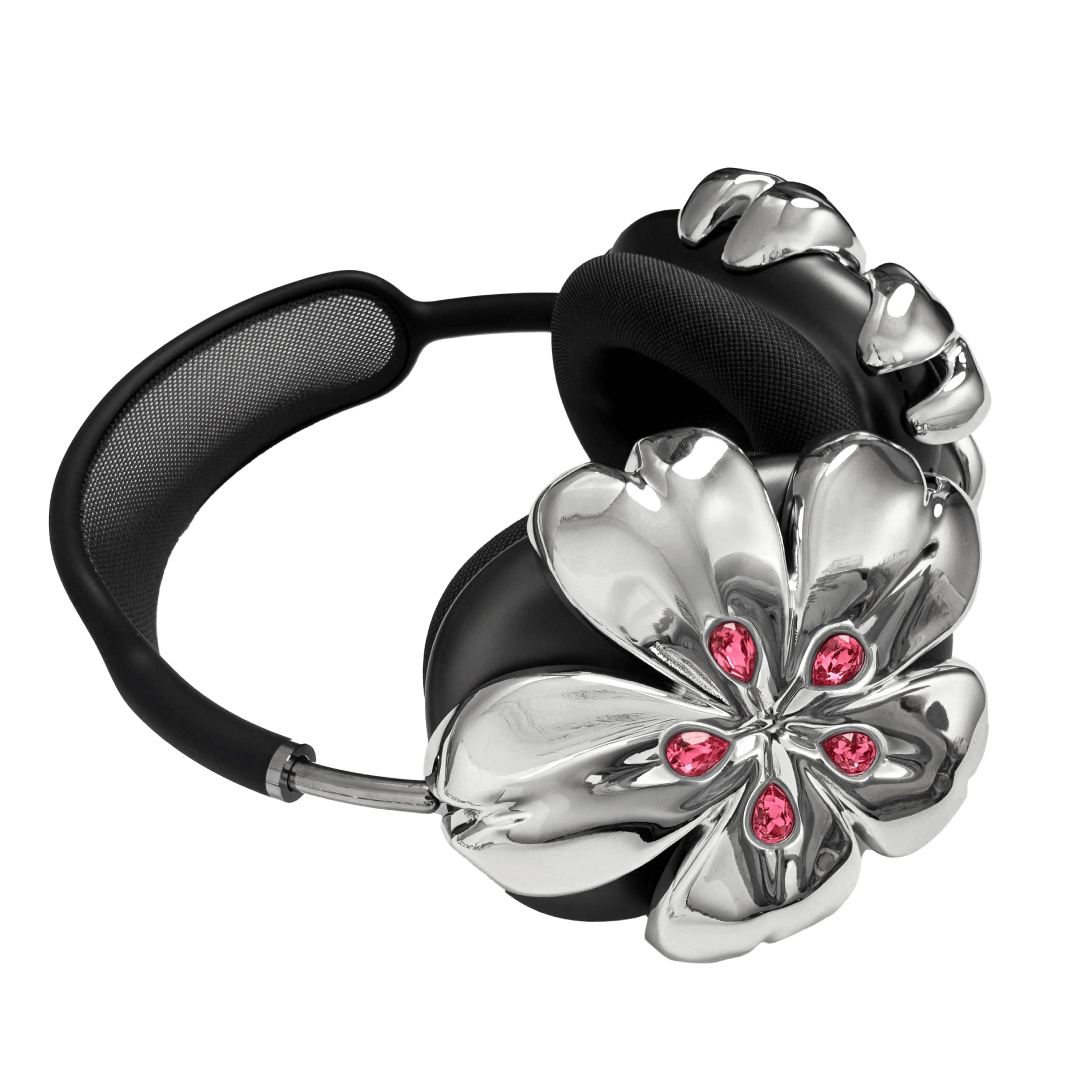Pink cherry blossom-shaped AirPods Max covers accented with sparkling crystal embellishments, adding a luxurious floral design.