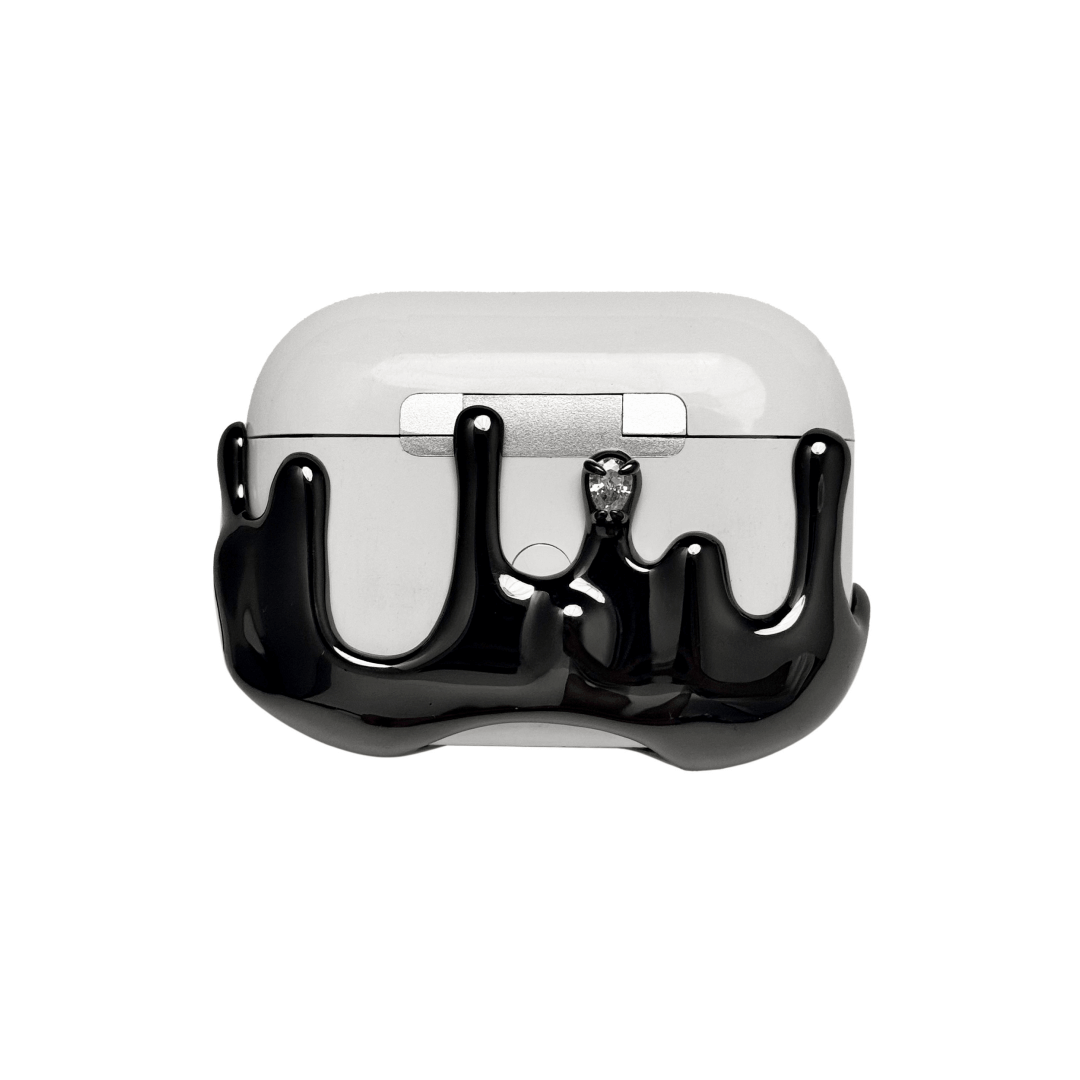AirPods case with upward-flowing silver surge design, featuring crystal accents at the tips of molten-like peaks for a rising liquid metal effect.