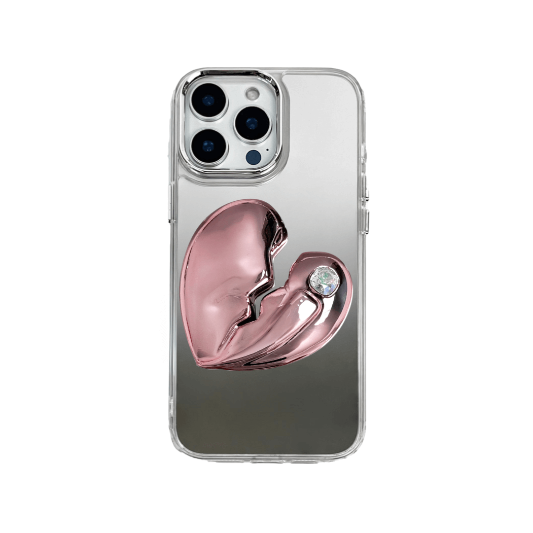 3D silver, pink, red and black metallic iPhone case featuring a cracked heart design with smooth chrome finish and a single embedded gem.