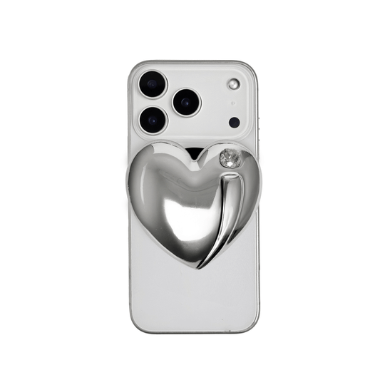 Metallic silver, pink, red, black Phone grip with a large sculpted heart in 3D, featuring a shiny chrome finish and a single gem-like detail.