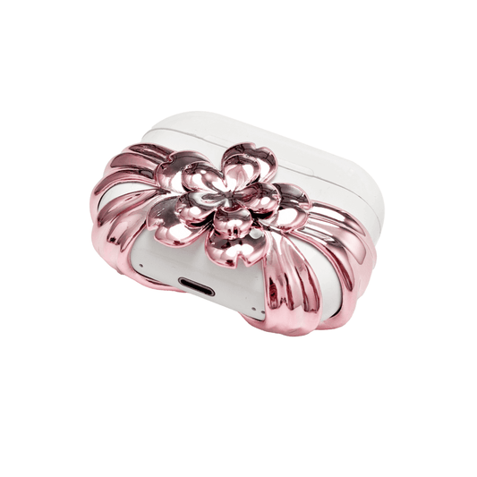 AirPods case cover decorated with a multi-petal cherry blossom in pink or silver, adding a soft and elegant floral accent to a sleek protective design.