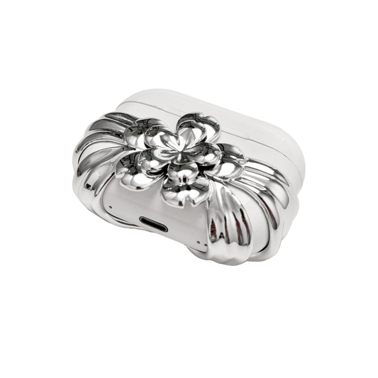 AirPods case cover decorated with a multi-petal cherry blossom in pink or silver, adding a soft and elegant floral accent to a sleek protective design.