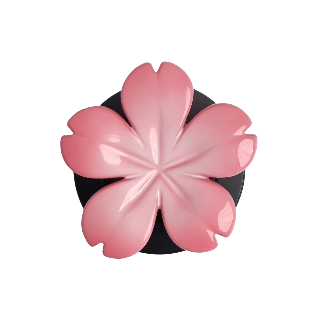 Magnetic phone grip with a silver mirror finish, decorated with a pink and silver cherry blossom flower for an elegant floral look.