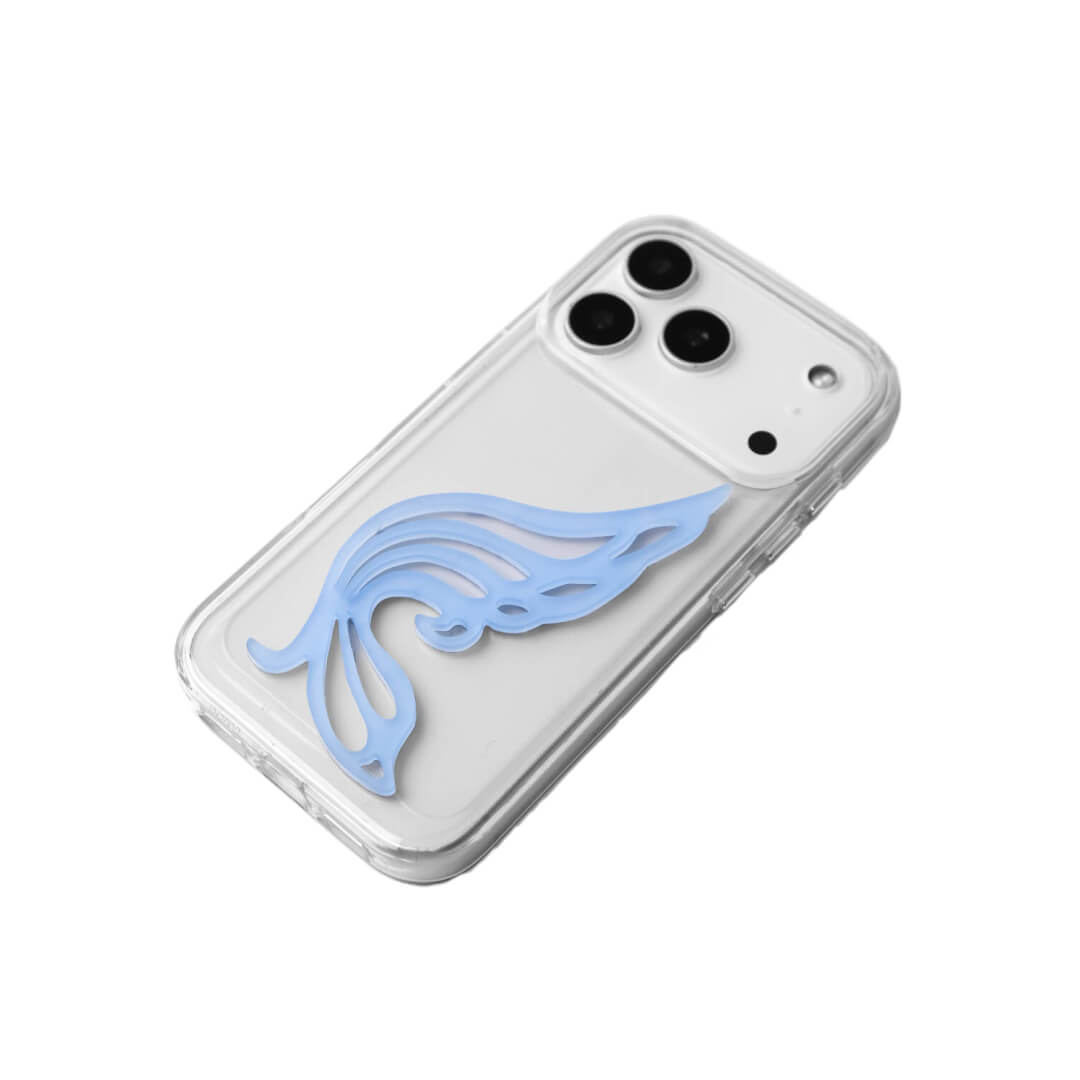 A stylish iPhone case featuring a 3D acrylic butterfly wing attachment with intricate, flowing cutouts. Available in two soft pastel colors: Sakura Pink and Azure Blue. The wing is shown mounted on a Clear Transparent base, highlighting its delicate, sculptural form.