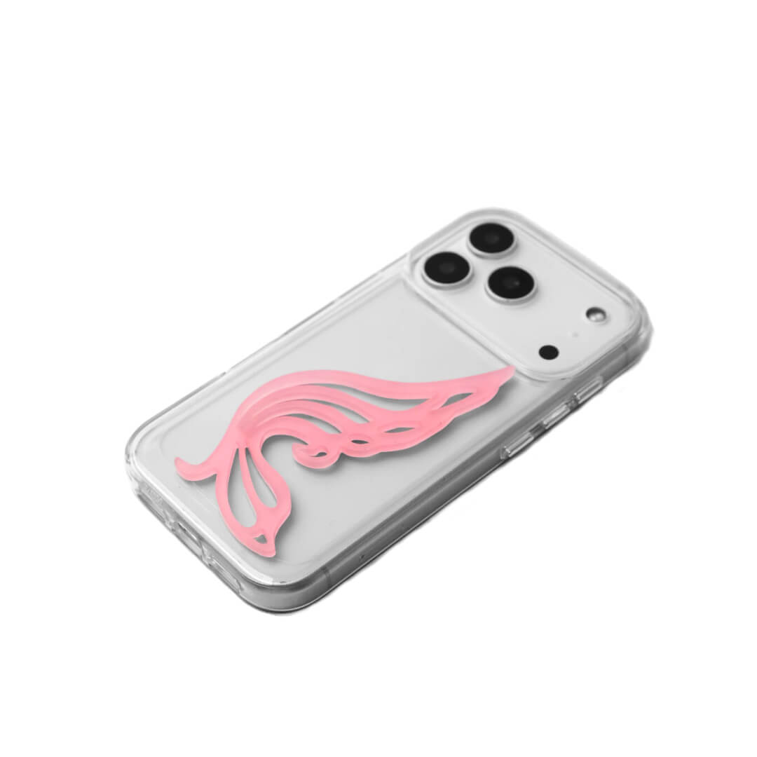 A stylish iPhone case featuring a 3D acrylic butterfly wing attachment with intricate, flowing cutouts. Available in two soft pastel colors: Sakura Pink and Azure Blue. The wing is shown mounted on a Clear Transparent base, highlighting its delicate, sculptural form.