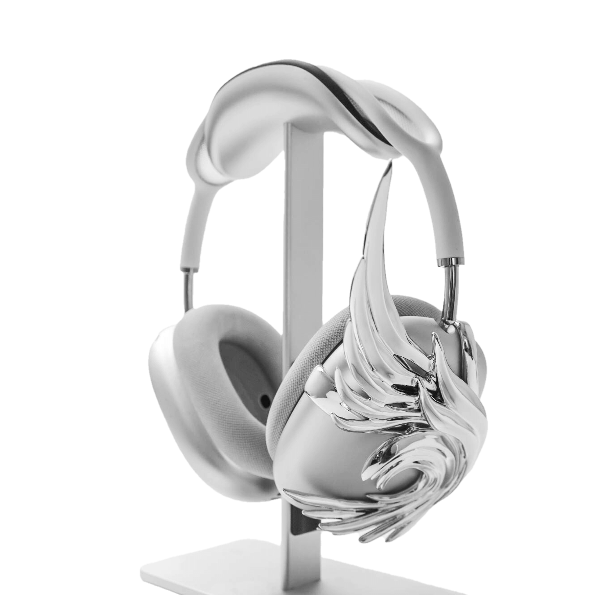 A sculptural 3D attachment for AirPods Max headphones featuring long, flowing angel wings with detailed feathers. The product is available in two versions: a reflective Silver Chrome and a soft Matte White, shown in both single and pair configurations on the headphone ear cups.