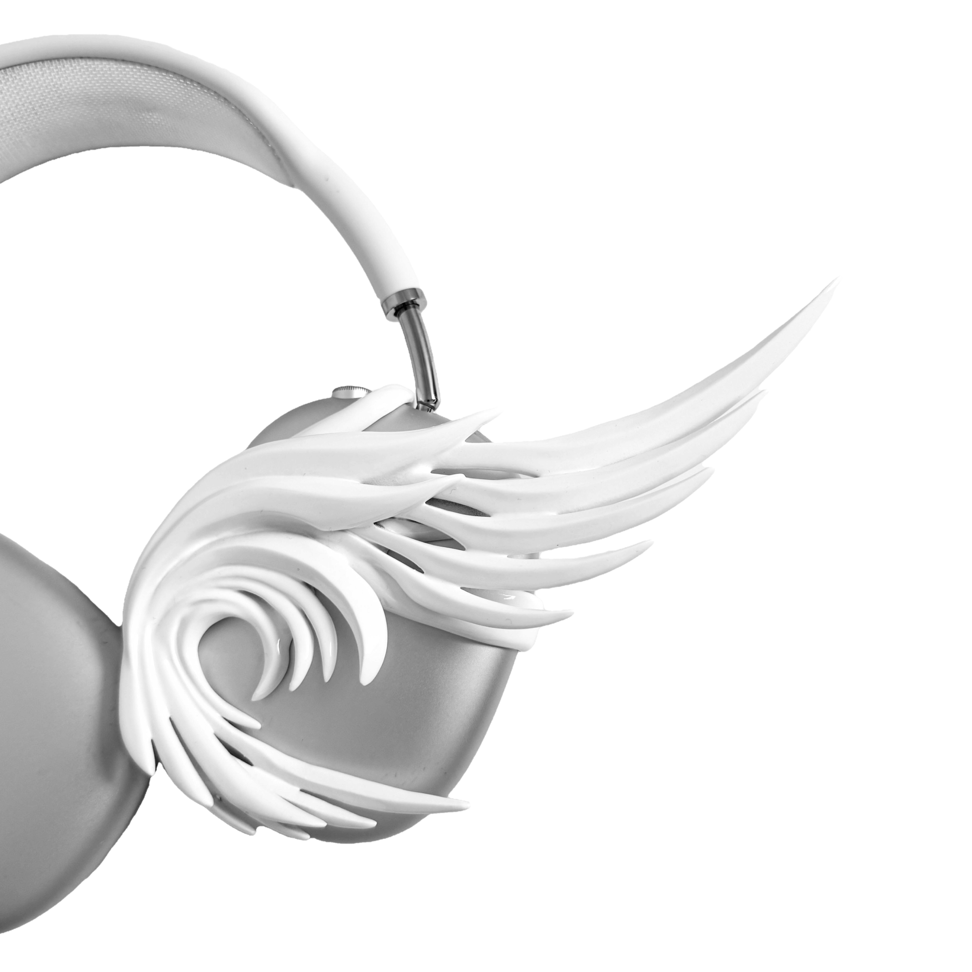 A sculptural 3D attachment for AirPods Max headphones featuring long, flowing angel wings with detailed feathers. The product is available in two versions: a reflective Silver Chrome and a soft Matte White, shown in both single and pair configurations on the headphone ear cups.
