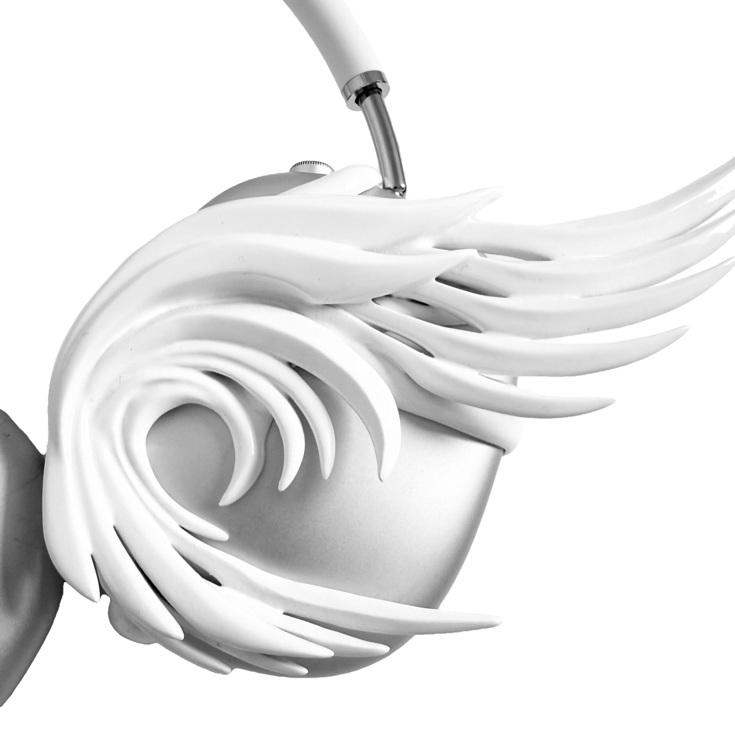 A sculptural 3D attachment for AirPods Max headphones featuring long, flowing angel wings with detailed feathers. The product is available in two versions: a reflective Silver Chrome and a soft Matte White, shown in both single and pair configurations on the headphone ear cups.