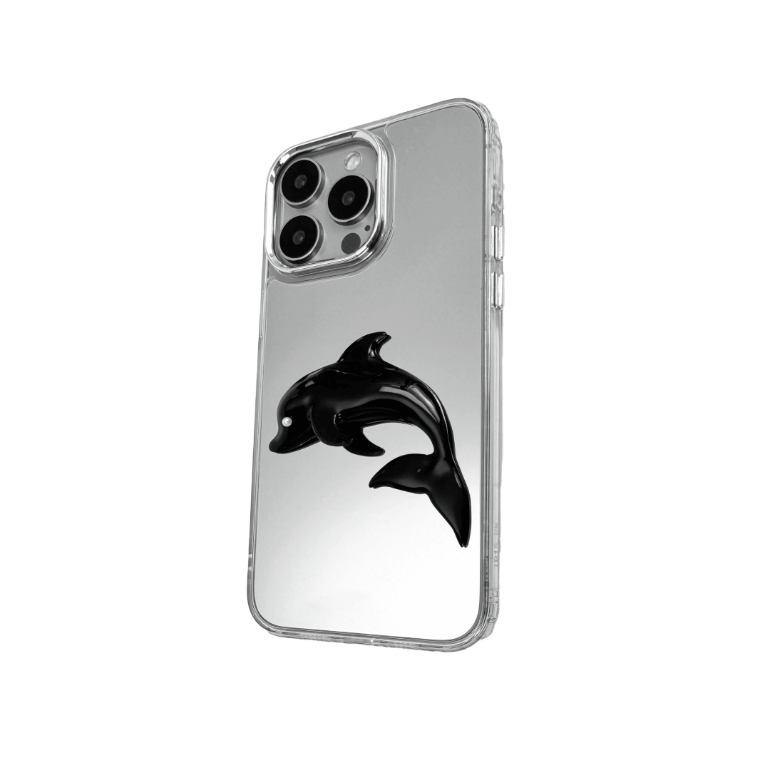 Matte phone case with a high-relief sculpted dolphin figure swimming diagonally across the back.