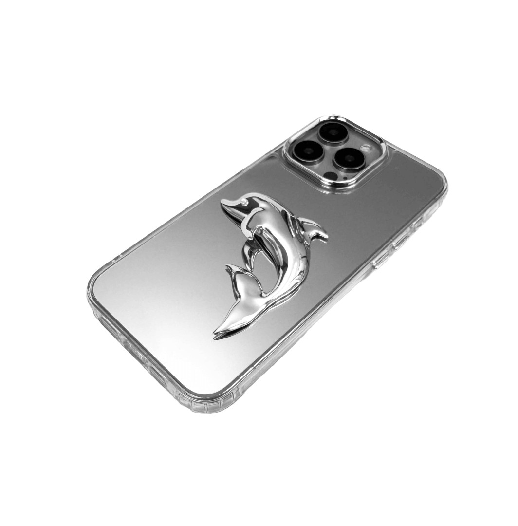 Matte phone case with a high-relief sculpted dolphin figure swimming diagonally across the back.