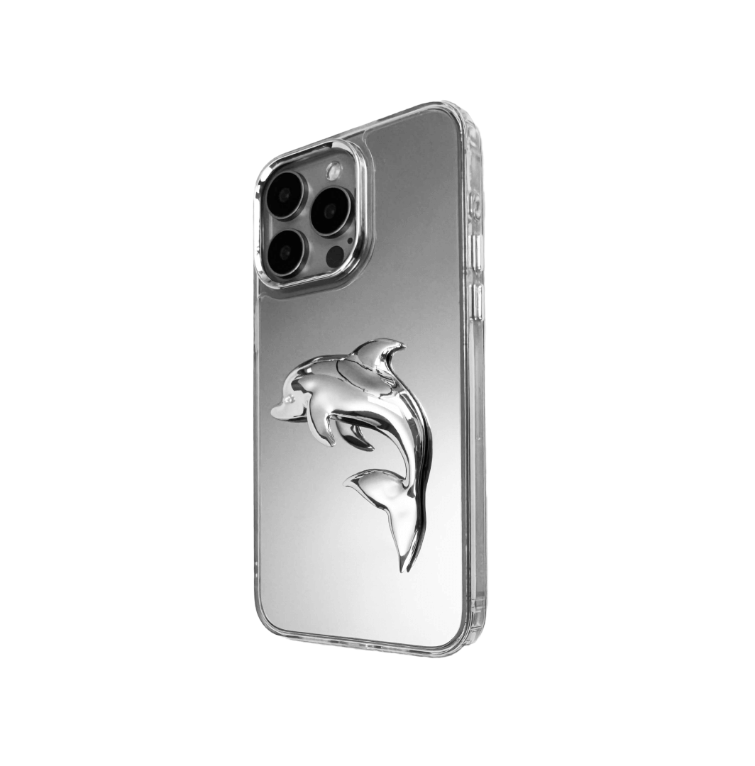 Matte phone case with a high-relief sculpted dolphin figure swimming diagonally across the back.